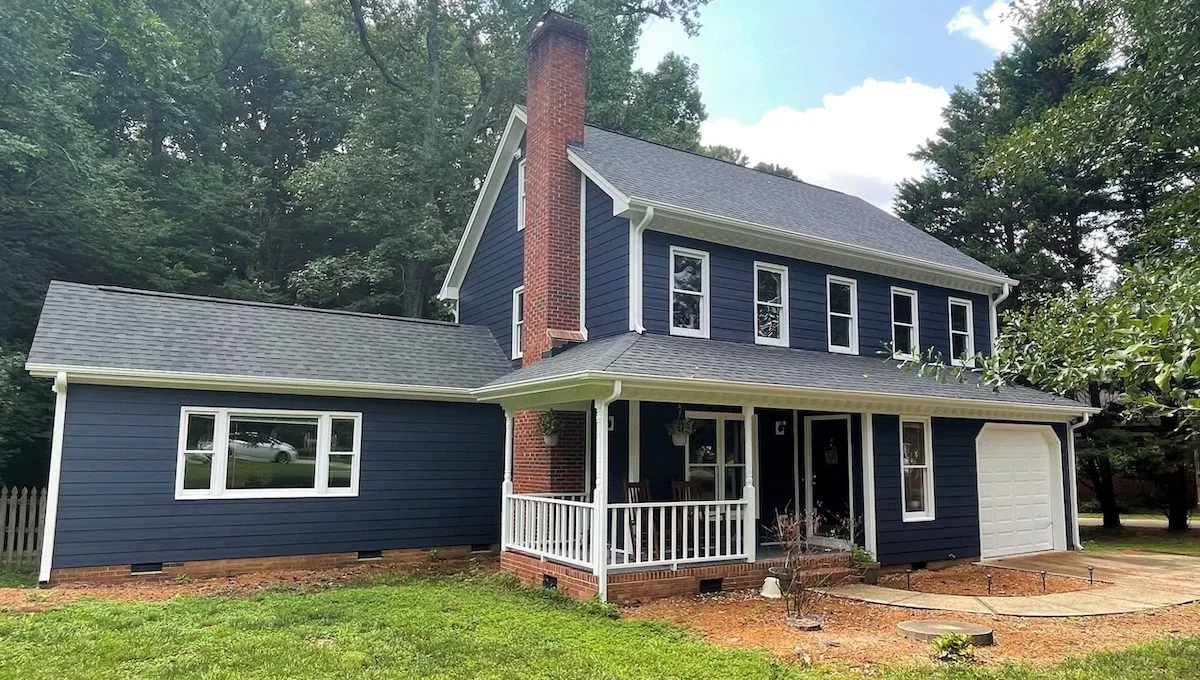 Home with new dark blue siding after home exterior remodeling services in Wake Forest, NC