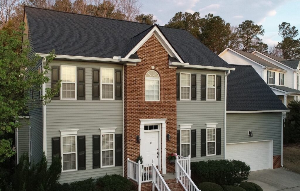 Home with seagreen siding.